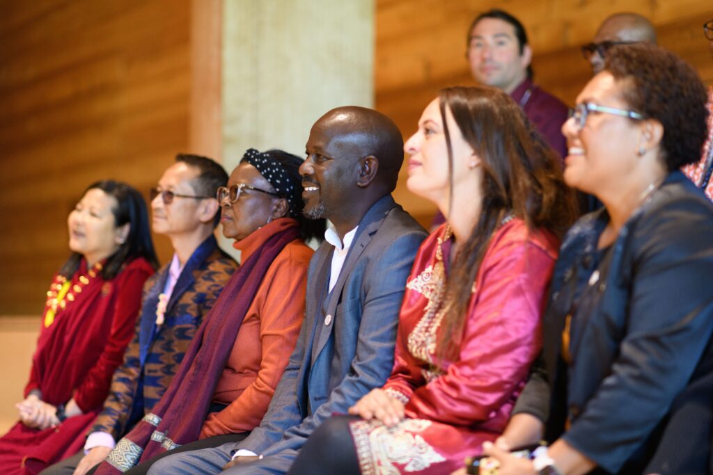 Cheerful distinguished Humphrey fellows seated at an event