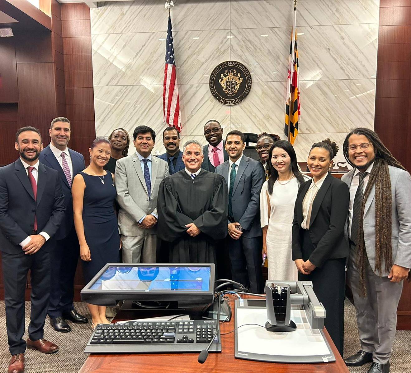 A gathering of attorneys, judges, and human rights activists posing for a photograph