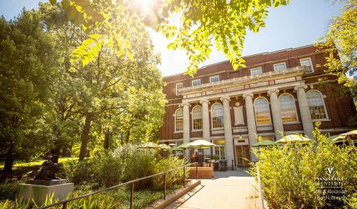 the sun shines brightly on the front of a building.