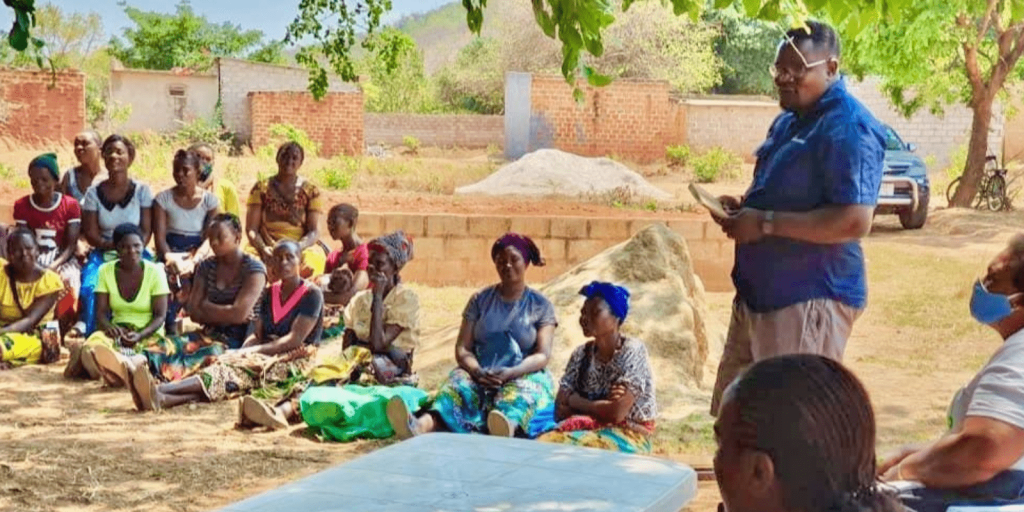 Ackson J. Mwanza training Women Farmers on Climate Sustainable Farming Practices.