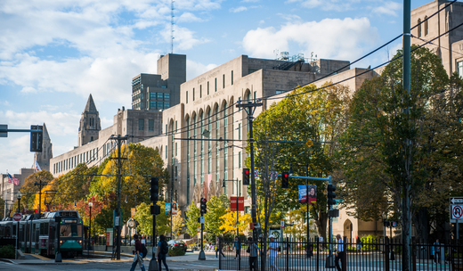 a city street filled with lots of tall buildings.