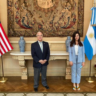 A man and a woman standing and posing for a picture.