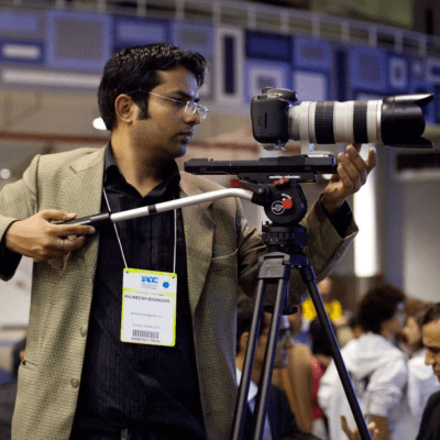 Rajneesh Bhandari looking into his camera.