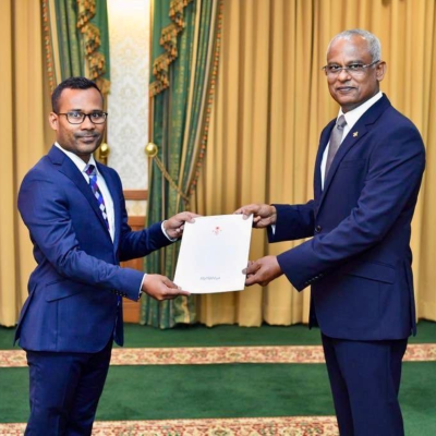 Dr. Abdul Malik being honored for his contributions.